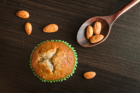 Banana cup cake on wooden background. Dessert Thai style.の写真素材