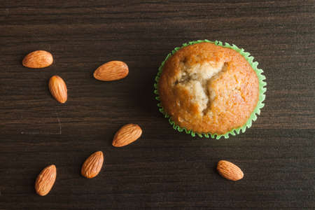 Banana cup cake on wooden background. Dessert Thai style.の写真素材