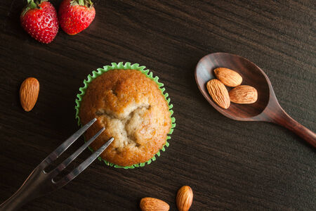 Banana cup cake on wooden background. Dessert Thai style.の写真素材