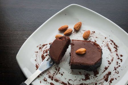 Dessert chocolate cake on a white plate. Eat dessert.の写真素材