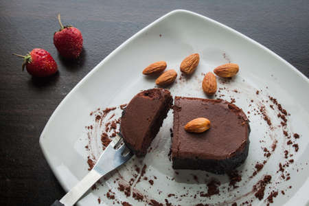 Chocolate cake with strawberries and almond.の写真素材