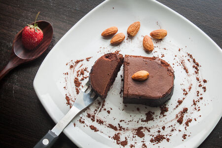 Chocolate cake with strawberries and almond.の写真素材