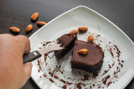 Dessert chocolate cake on a white plate. Eat dessert.の写真素材