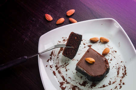 Dessert chocolate cake on a white plate. Eat dessert.の写真素材