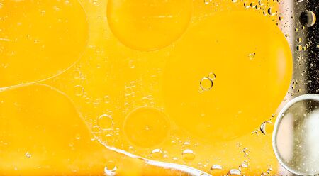 Oil drops on a water surface. Abtract background.の写真素材