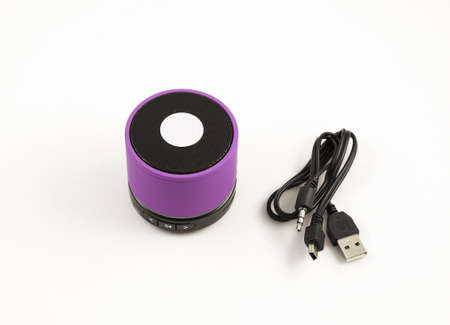 Purple speaker. Sound loudspeaker or stereo equipment on a white background.の写真素材
