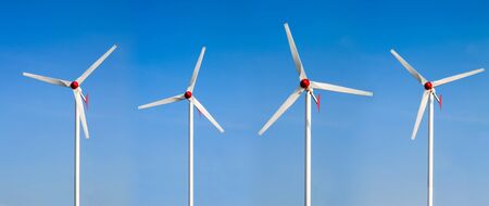 Wind power station against the blue sky. Wind turbines motion.