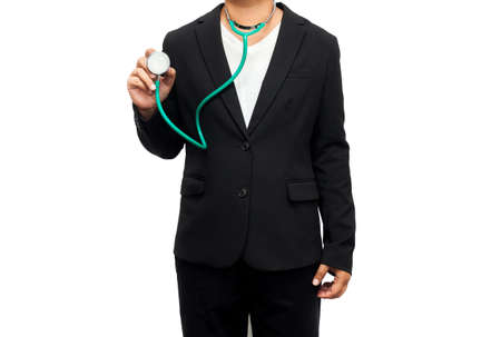 Doctor with stethoscope in the hands on white background. Healthcare and medicine.の写真素材