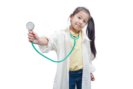 Little asian girl in a doctors uniform on a white background.の写真素材