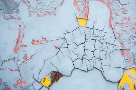 Abstract corroded wallpaper grunge background iron rusty wall peeling paint.の写真素材