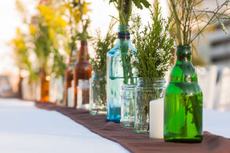Flower vase wedding decorations for the ceremony on tableware.の写真素材