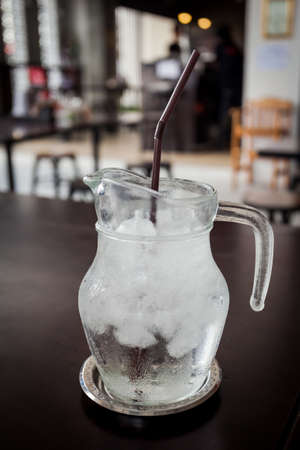 Jug cold drinking water glass on table in a restaurant.の写真素材