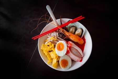 Noodles with seafood soup and red sauce, yong tau foo.