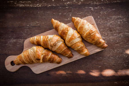 Tasty croissants on wooden.の写真素材