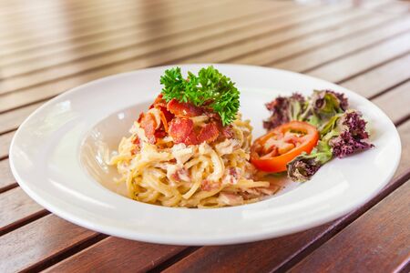 Spaghetti carbonara. Spaghetti with bacon white cream sauce.の写真素材