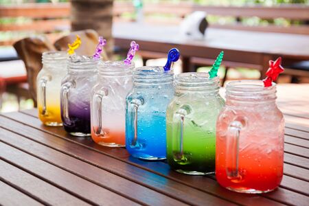 Set with different cocktails on white background on the wood table.の写真素材