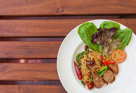 Stir-Fried Spaghetti with Thai Spicy Sausage.の写真素材
