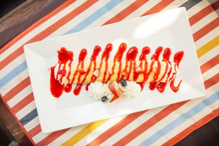 Sweet Rolled Pancakes roll with berry and cream.の写真素材