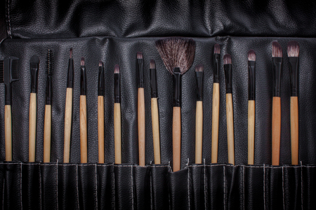 Set of brush makeup in a leather bag.の写真素材