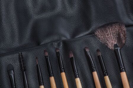 Set of brush makeup in a leather bag.の写真素材