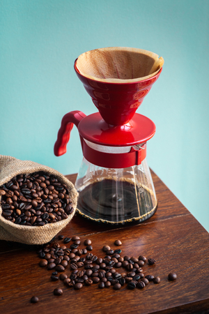 Roasted coffee bean in vintage grinder with coffee maker.の写真素材