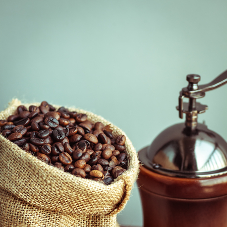 Roasted coffee bean in vintage grinder with coffee maker.の写真素材