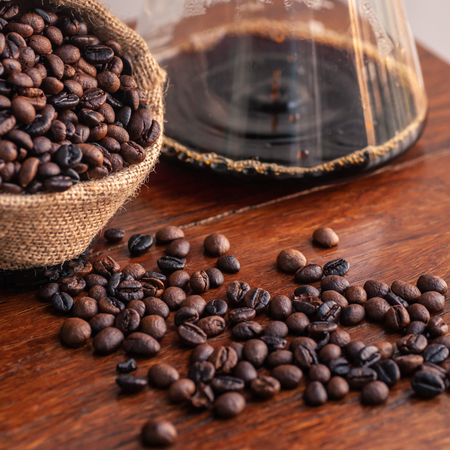 Roasted coffee beans in sacksの写真素材