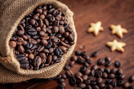 Roasted coffee beans in sacksの写真素材