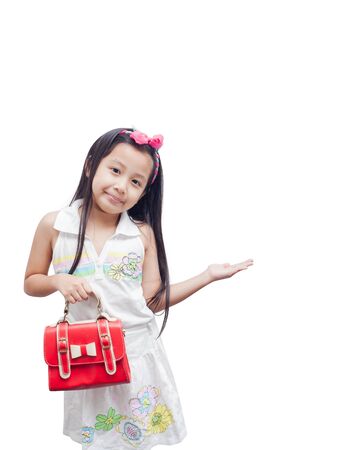 Little girl in white dress as fashion model over white background.の写真素材