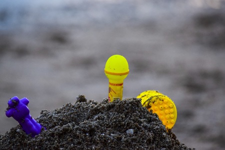 Toys on the beach with blurred background.の写真素材