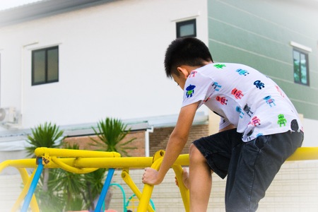 Children play a variety of toys in the playground.の写真素材