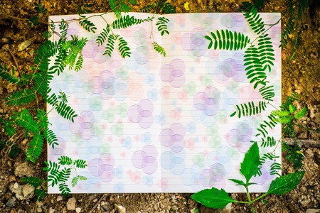 White paper with green leaf , for note.