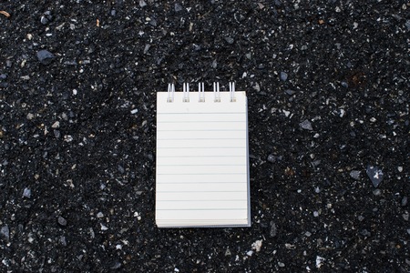 White paper on the stone floor is used for note taking.の写真素材