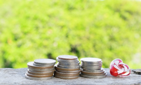 Old coins on wooden floors apply to finance.