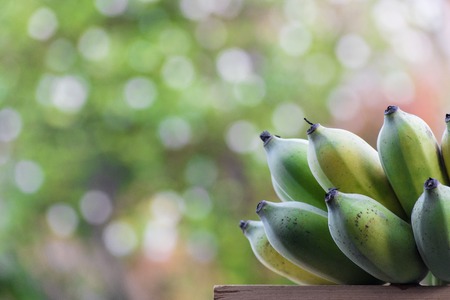 banana on the wood and bokeh background using wallpapers or background.の写真素材