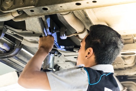 BANGSAN, THAILAND - September , 2017 : Man repairing car brand japan parked in the showroom in...