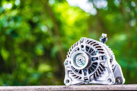 Car spare parts on tree blurry bokeh background. using wallpaper or background for Automobile industry and car factory product with package.の写真素材