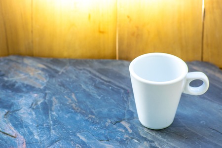 Glass white color  on a wood background.  Using wallpaper or background for  package with product and refreshing.の写真素材