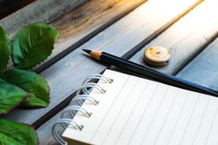 Notepad with pencil and starfish, shellfish on wood background.using wallpaper for education, business photo. Take note of the product for book with paper concept or copy space and refreshing.の写真素材