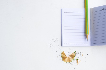 Notepad with pencil on wood board background. using wallpaper or background for education, business photo. Take note of the product for book with paper and concept or copy space.の写真素材