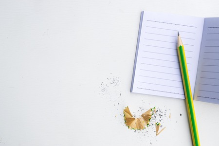 Notepad with pencil on wood board background. using wallpaper or background for education, business photo. Take note of the product for book with paper and concept or copy space.の写真素材