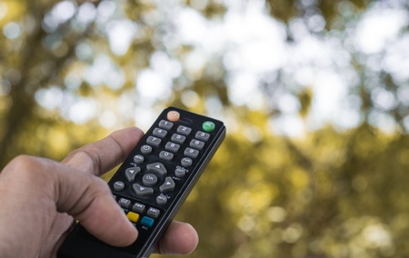 Remote control on tree blurry background in garden..This a control with nature  and concept image for filling refreshing and copy space work.の写真素材