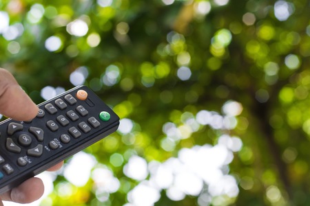 Remote control on tree blurry background in garden..This a control with nature  and concept image for filling refreshing and copy space work.の写真素材