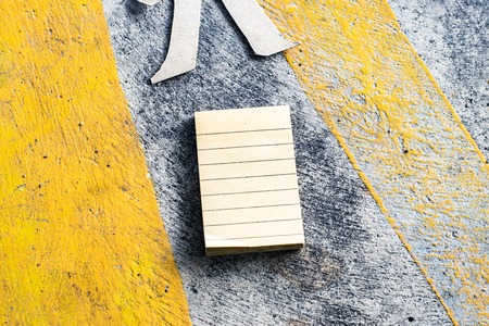 Notepad on street background. In nature and city. using wallpaper or for education photo. Dry notebook take note of the product for book with paper and concept or copy space.の写真素材