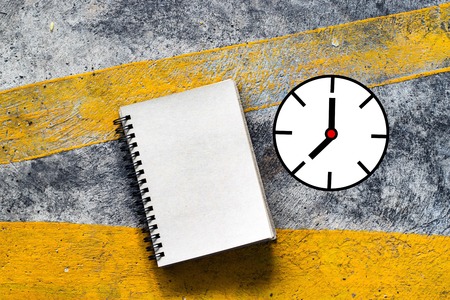 Notepad with clock vector on street background. In nature and city. using wallpaper or for education photo. Dry notebook take note of the product for book with paper and concept or copy space.の写真素材