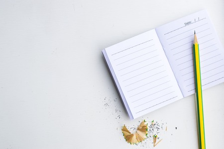 Notepad with pencil on wood board background. using wallpaper or background for education, business photo. Take note of the product for book with paper and concept or copy space.の写真素材