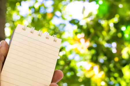 Notepad with pencil on wood board background. using wallpaper or background for education, business photo. Take note of the product for book with paper and concept or copy space and note.の写真素材