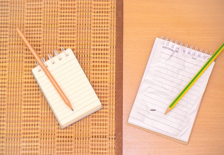 Notepad with pencil on wood board background.using wallpaper for education, business photo.Take note...