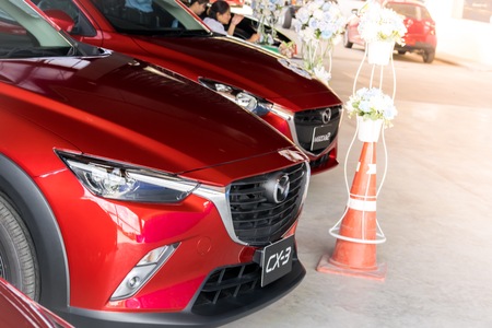 BANGSAN, THAILAND - September , 2017 : Red car mazda brand japan parked in the showroom in Thailand for customers.のeditorial素材