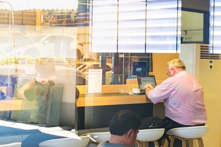 BANGSAN, THAILAND - September , 2017 :  Men are working with computer in service center mazda brand japan.This showroom of thailand for customers.のeditorial素材